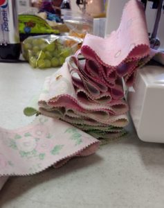 Photo of fabric being sewn into two rows for a Jelly Roll Race quilt