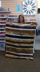 Jelly Roll Race quilt created by Tracy