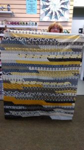 Jelly Roll Race quilt created by Marilu