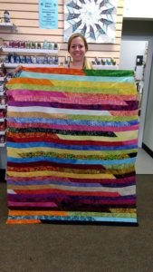 Jelly Roll Race quilt created by Cat