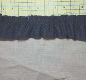 Photo of ruffle sewn to base fabric using a gathering foot, one of two sewing machine feet for gathering fabric