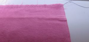 Photo of two lines of thread basted to top of fabric to be used for gathering the fabric