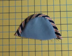 Photo of fabric binding cut on bias and attached to a curved piece of fabric