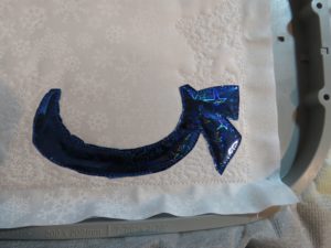 Photo of blue Mylar scarf with excess Mylar trimmed away