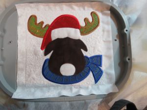 Photo of Christmas Moose with Mylar embroidery for antlers, hat and scarf and base fabric for head