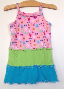Girl's dress with rolled hems on ruffles