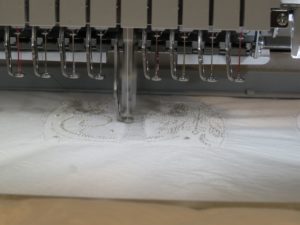 photo of body pieces of freestanding embroidered snowman being sewn out