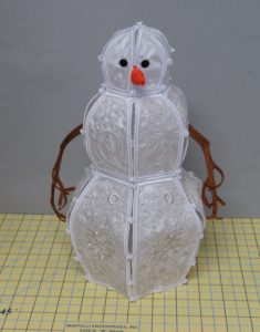 Photo of assembled freestanding embroidered snowman with pins removed