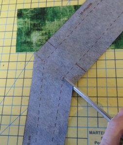 Photo of section 2 piece of fabric, showing where to clip the concave corner for the square tuffet
