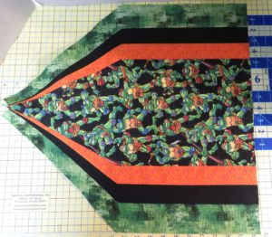 Completed side of square tuffet with sections 2A, 1 and 2AR sewn together