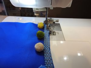 Photo of sewing trim on pocket lining of laminated cotton beach bag 