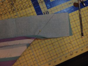 Photo of pencil mark to denote where to sew to create a mitered quilt border