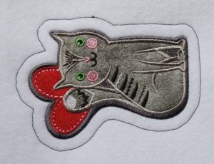 Photo of sewn iron-on patch outline stitch 