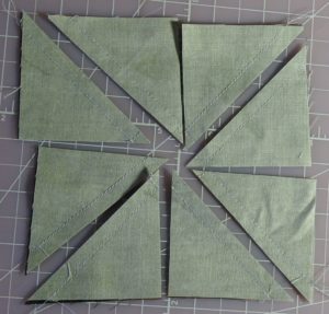 Eight half-square triangles created from two squares of fabric