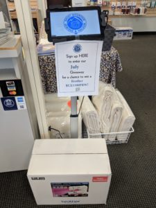 Photo of kiosk stand for kiosk give-away at the Arvada location