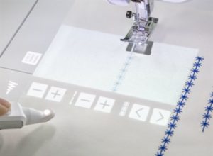 Photo of changing properties of projected stitch design on the Brother Luminaire
