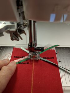 Photo of placement of third ribbon in triple ribbon stitches