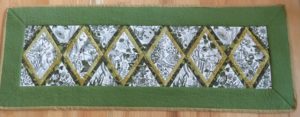 Photo of table runner made from Anita Goodesign's Botanical Impressions collection