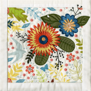 Photo of Anita Goodesign quilt block using printed fabric with embroidery