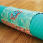 Photo of yoga mat wrapped with embellished initial made as sample for one of RMSV November events