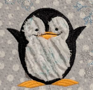 Photo of completed chenille penguin