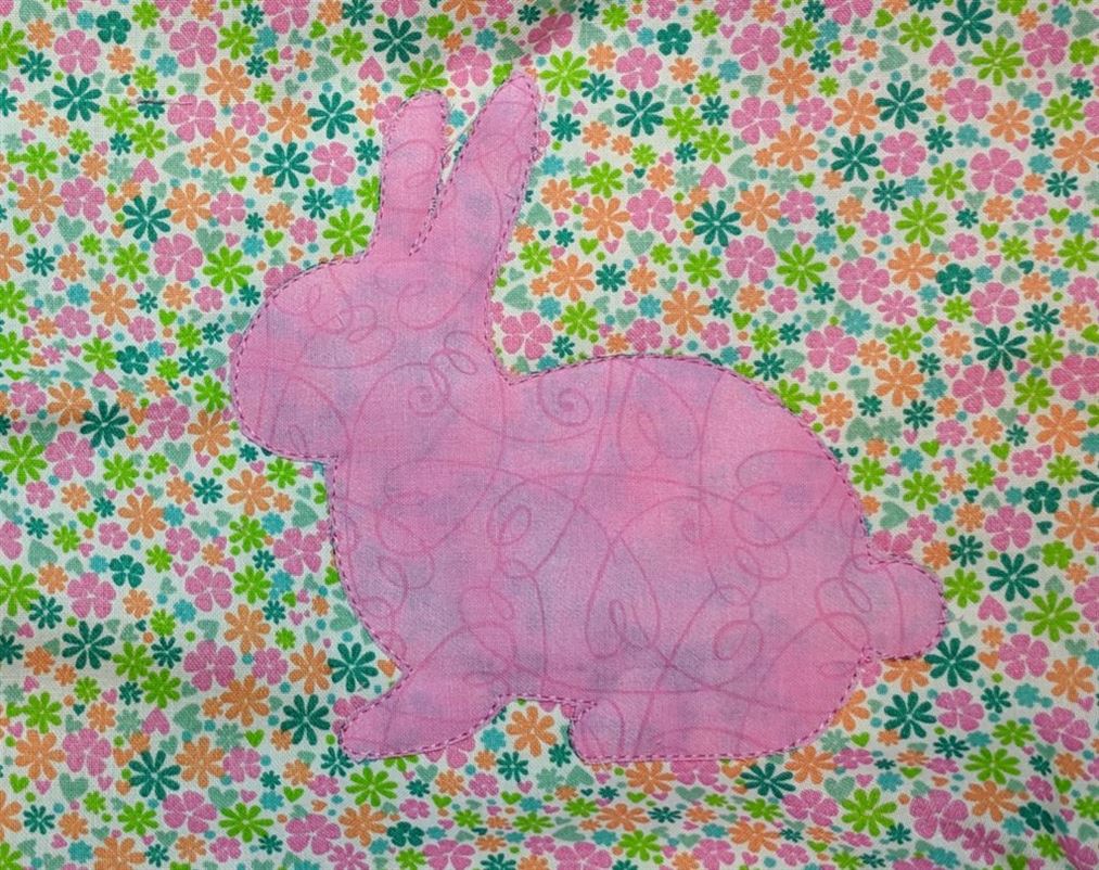 Photo of flowered fabric with pink bunny applique