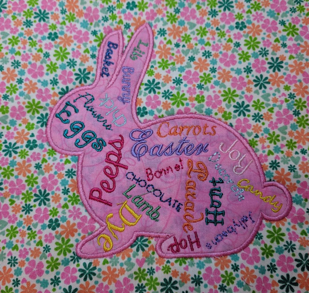 Finished word collage bunny applique with satin stitch border