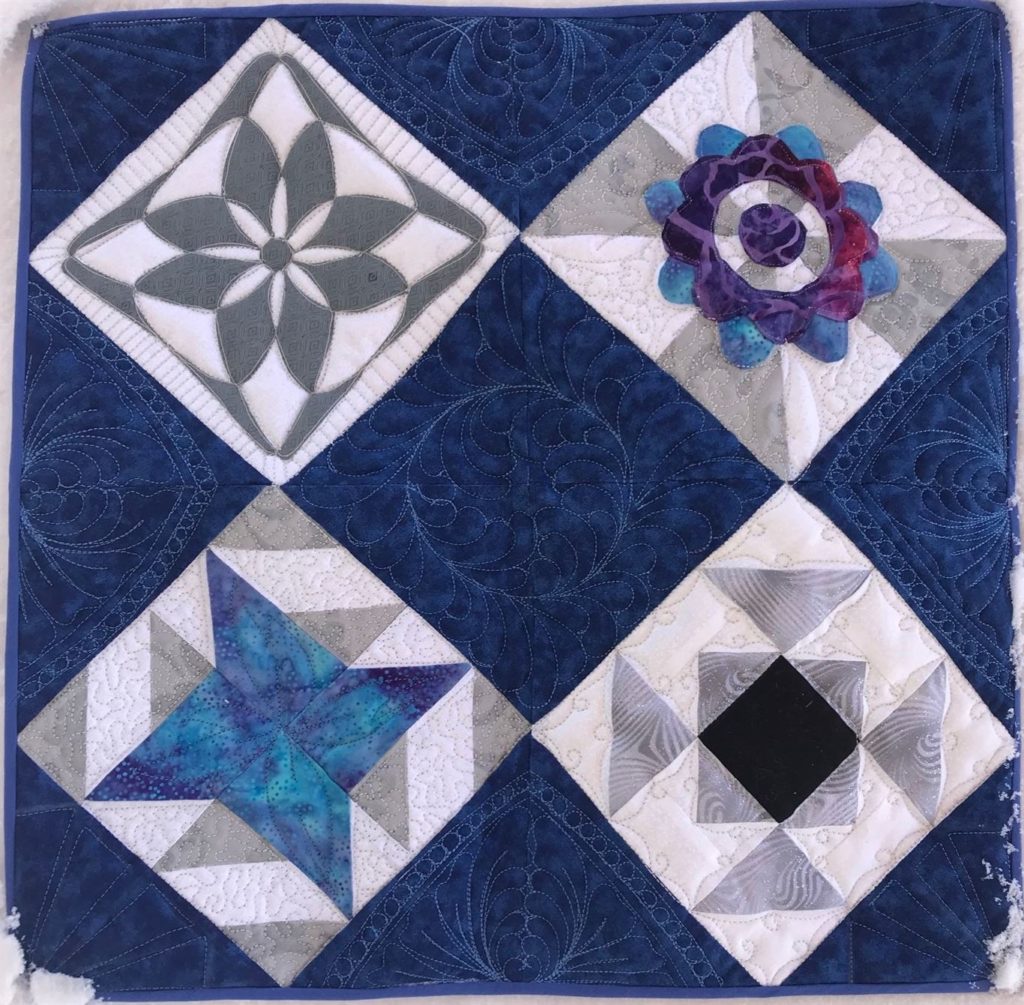 Photo of quilt blocks for Ruler work class at the Aurora store in May events