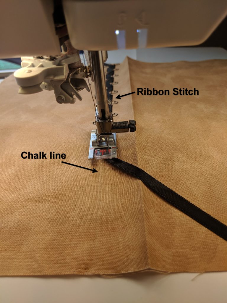 Photo of sewing ribbon stitch on pocket for folded accessory holder