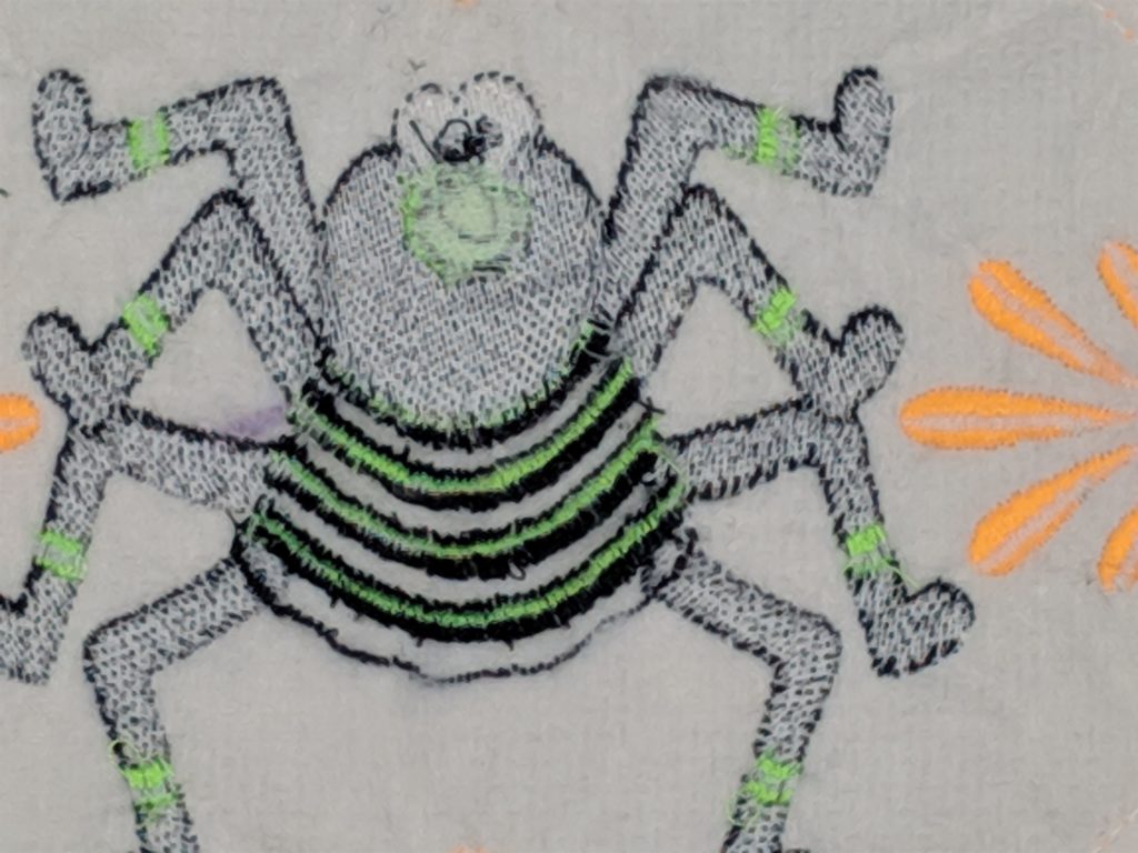 Back of spider embroidery with all rows of bobbin thread removed