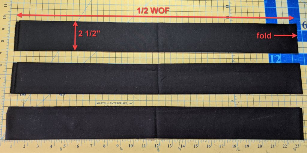 Photo of three 2.5' x WOF strips of fabric for tea towel apron ties