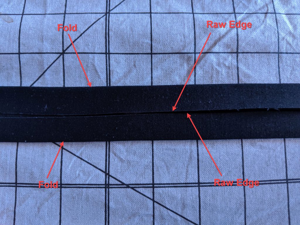 Photo of apron ties with edges folded in toward center