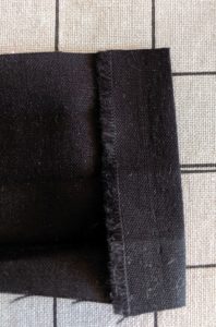 Photo of end of fabric strip with 1/4"folded over WST