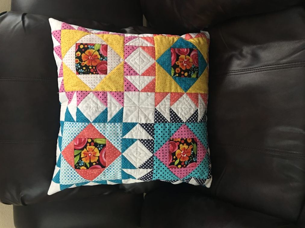 Photo of pillow made by paper piecing, one of in-store January events