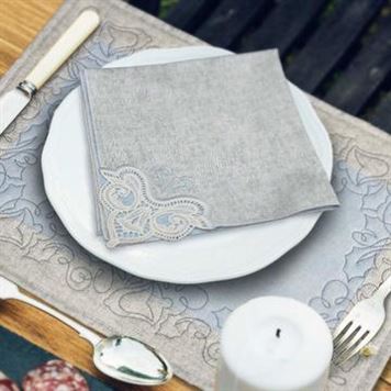photo of corner lace napkin and placemats embroidered from the OESD Silver Bells Decor collection