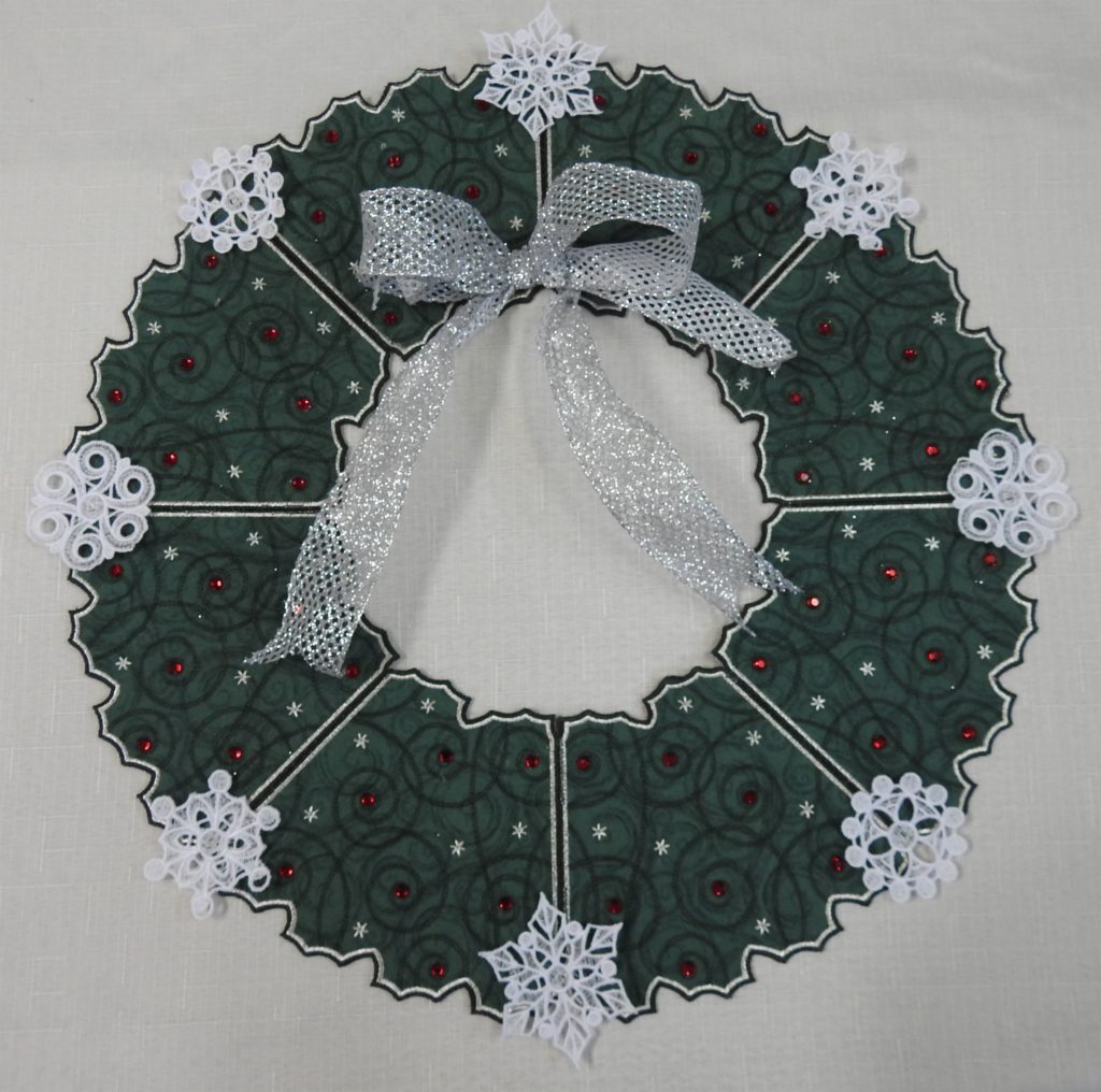 Picture of finished Free Standing Holiday Wreath with silver bow attached.