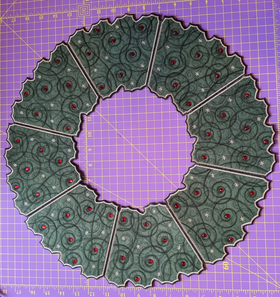 Photo of Free Standing Holiday Wreath with red rhinestones added