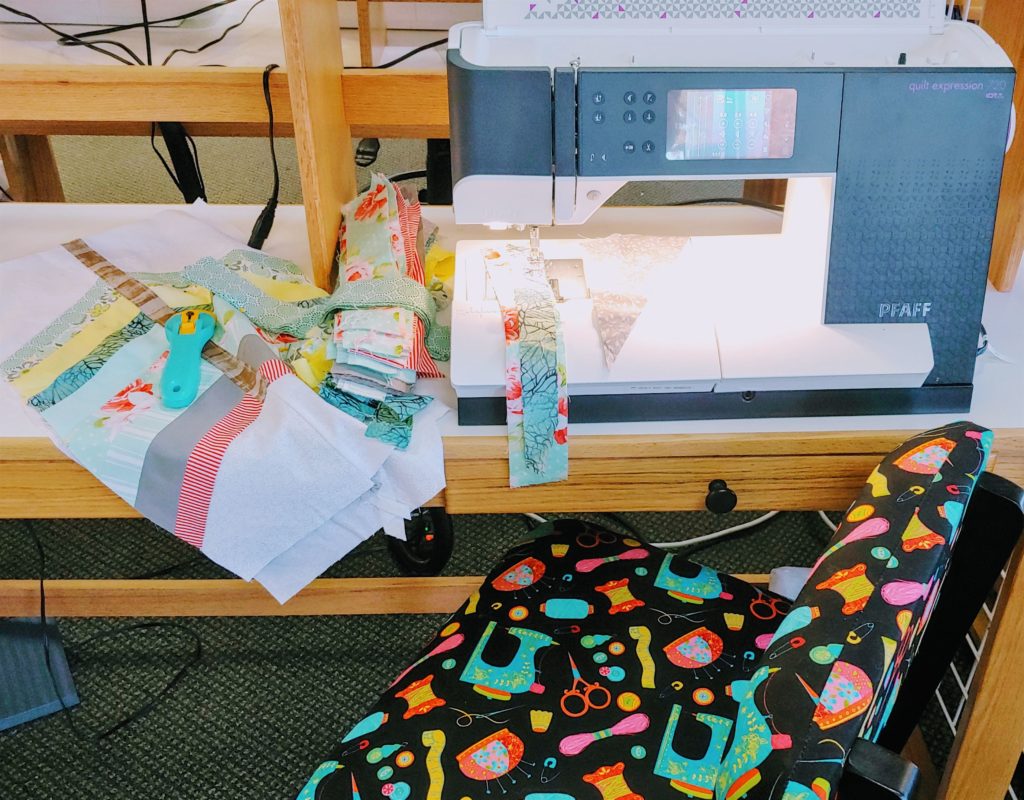 photo of sewing machine with fabric strips and quilt block forArvada open sew one of  January events