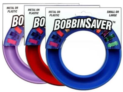 Photo of three round bobbin savers in lavender, red and blue
