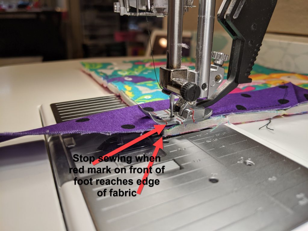 photo of corner of project showing where to stop sewing to create mitered corner
