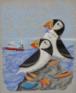 Using the right thread for this puffin design includes Floriani polyester and Embellish matte thread