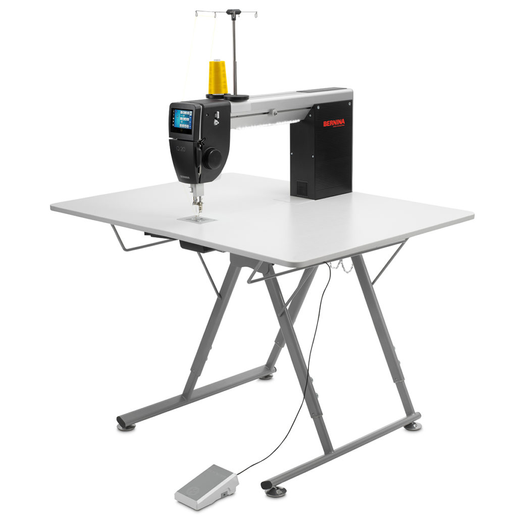 Bernina Q20 longarm quilting machine on folding table