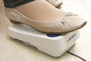 Foot Controller with Thread Trimming Function